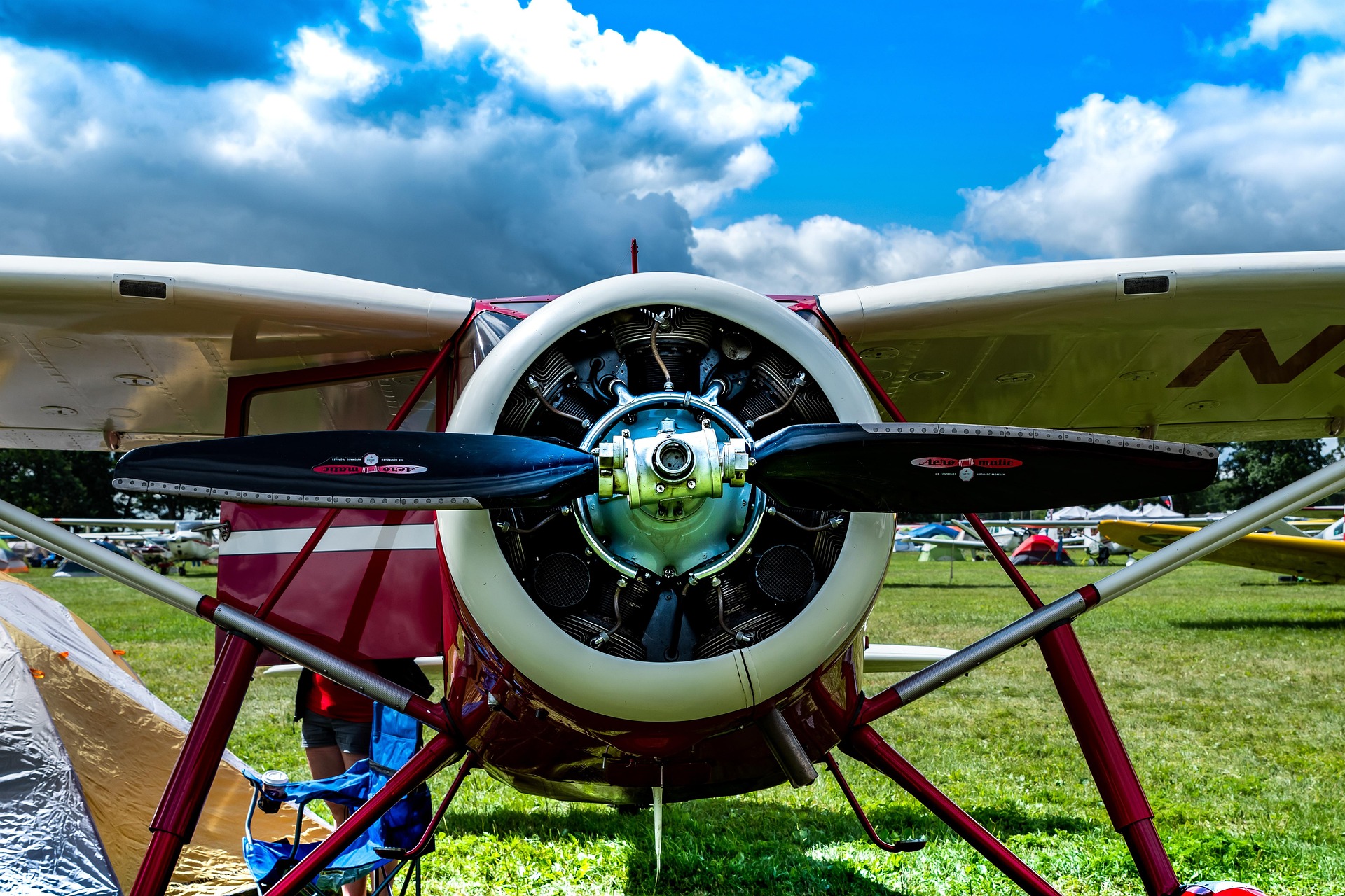 Airplane wing over clouds